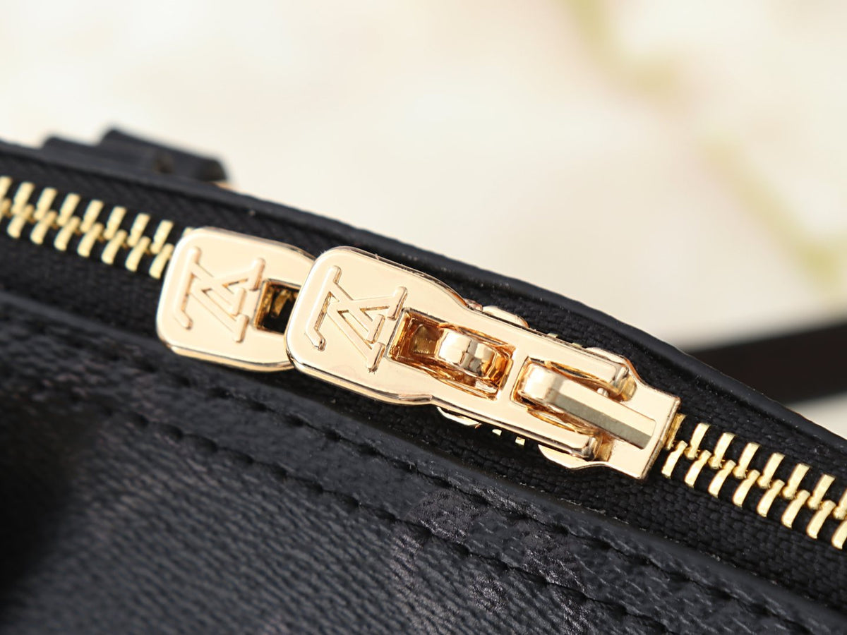 Louis Vuitton Squire East West Monogram Handbag — detail