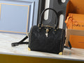 Louis Vuitton Embossed Louis Vuitton Structured Handbag — hero