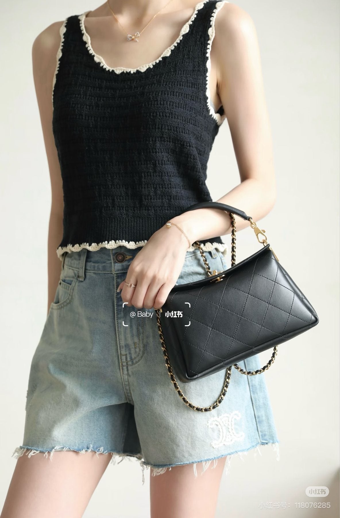 Chanel Diamond-Quilted Top-Handle Bag — model