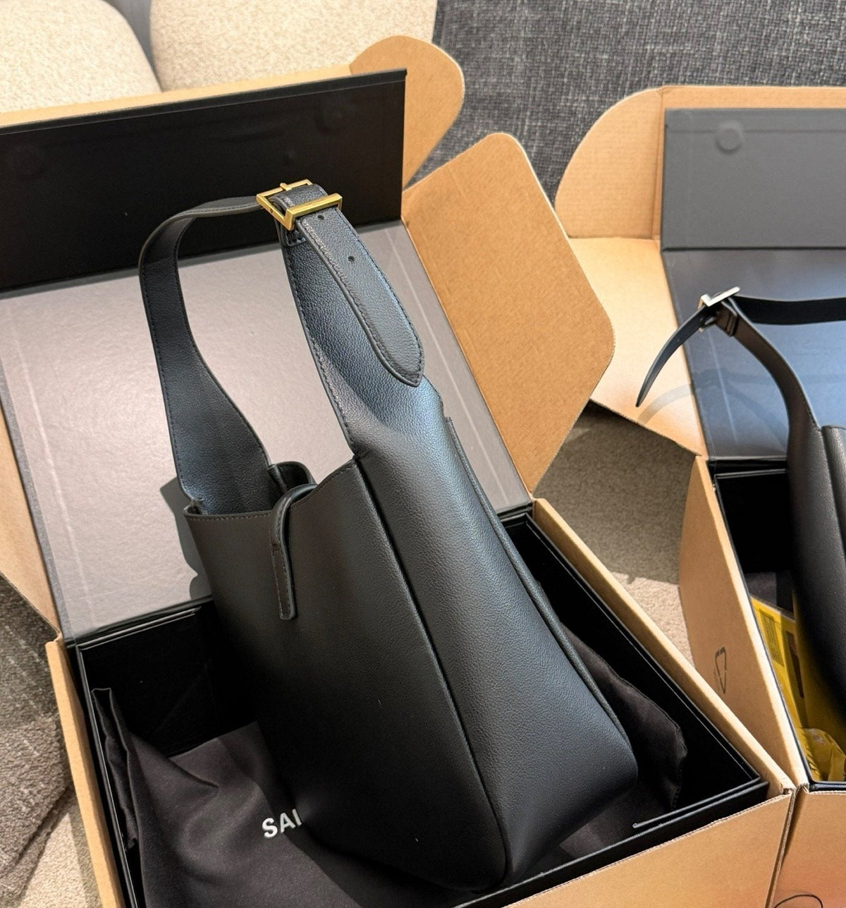 Saint Laurent Black Curved Hobo Shoulder Bag — side