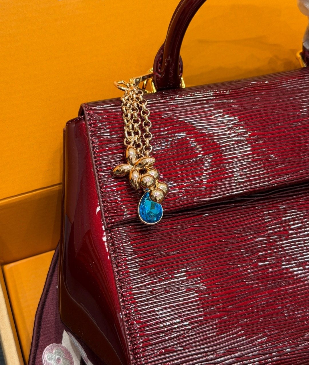 Louis Vuitton Cluny BB Glossy Textured Top-Handle Bag — detail
