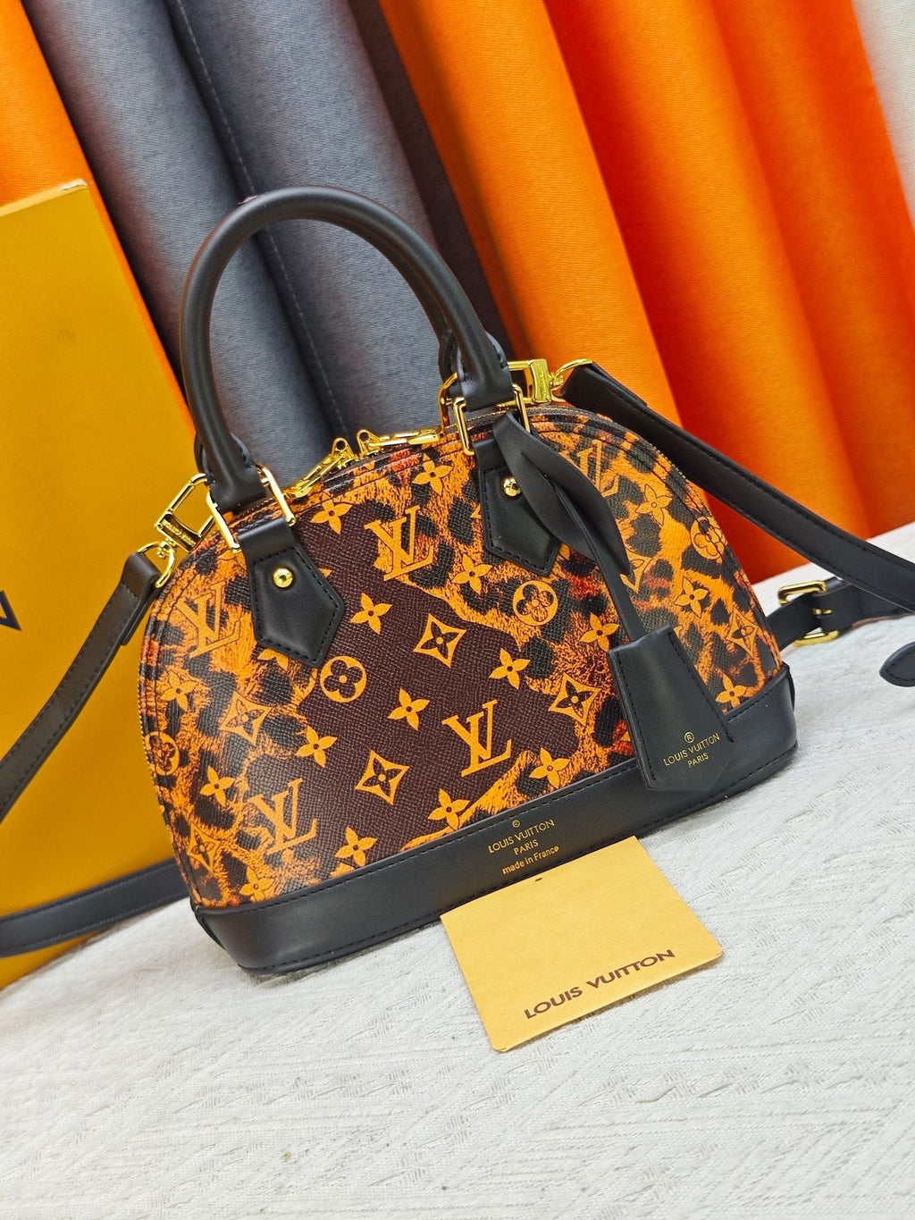 Louis Vuitton Alma BB Domed Top-Handle Bag — front