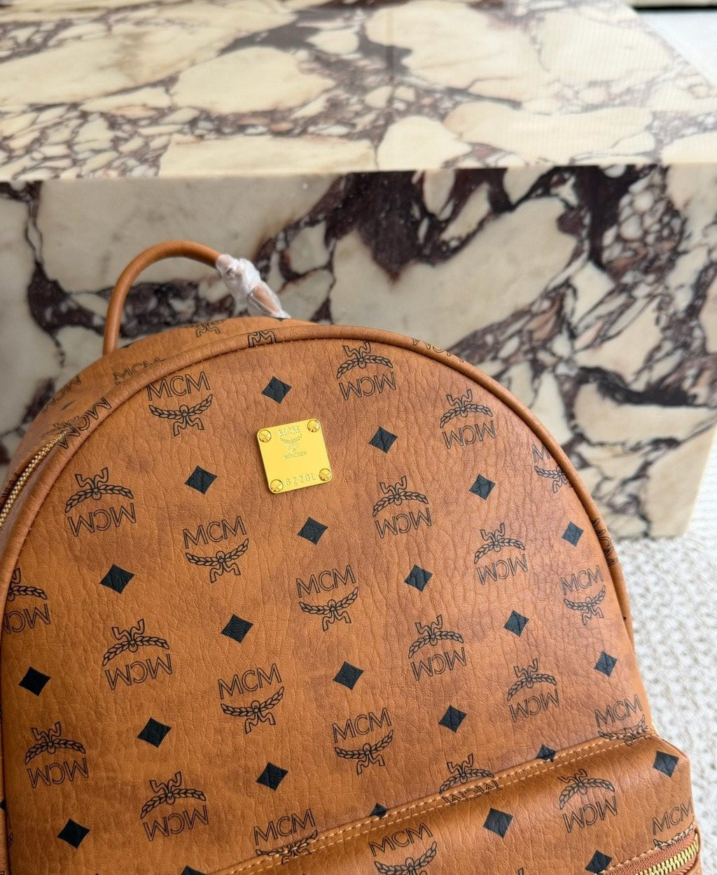 MCM Studded Monogram Backpack — detail