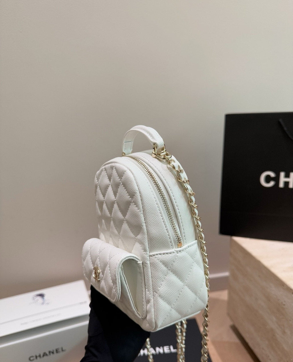 Chanel Quilted Top-Handle Backpack — side