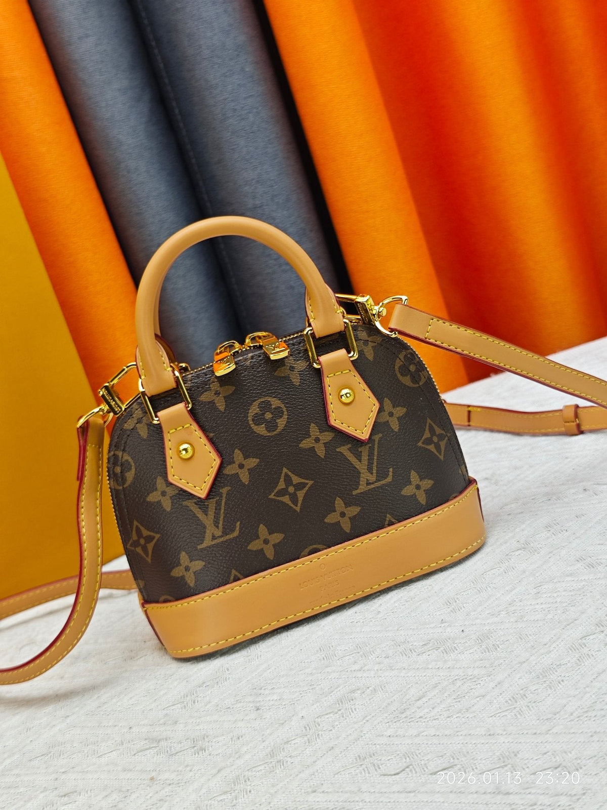 Louis Vuitton Nano Alma Monogram Top-Handle Bag — hero