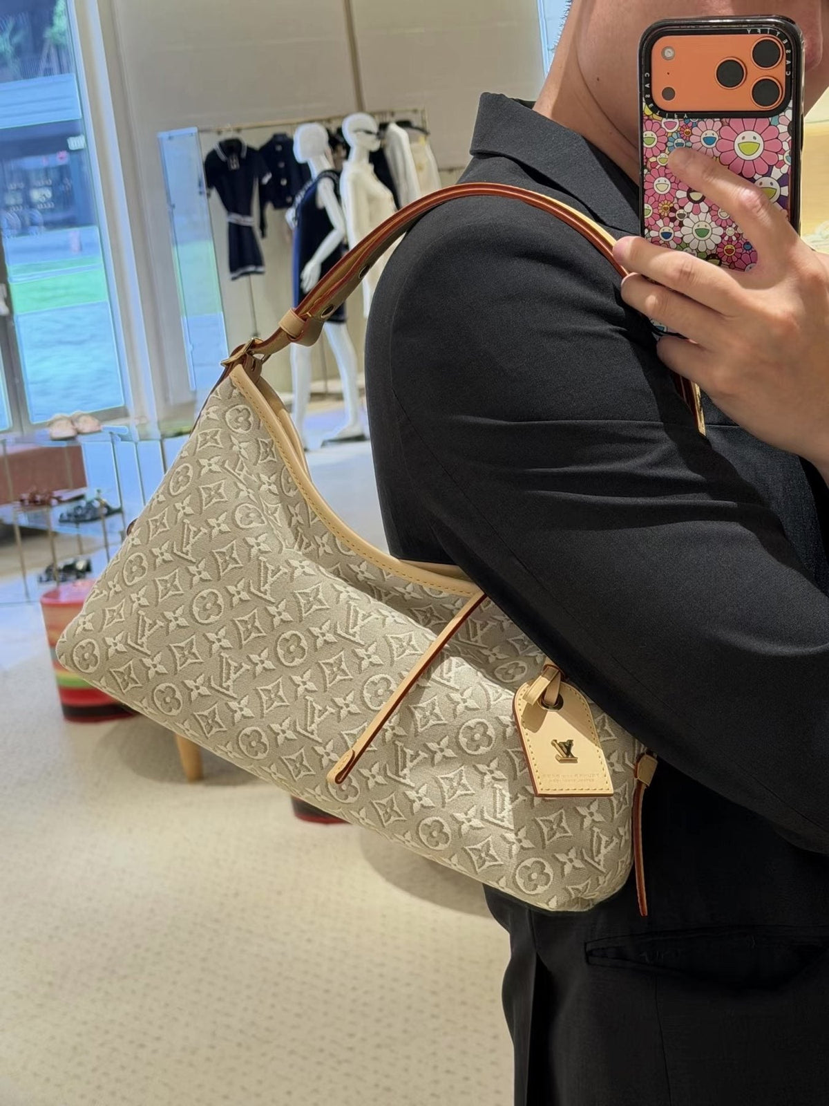 Louis Vuitton Carryall East West Raised Monogram Shoulder Bag — model