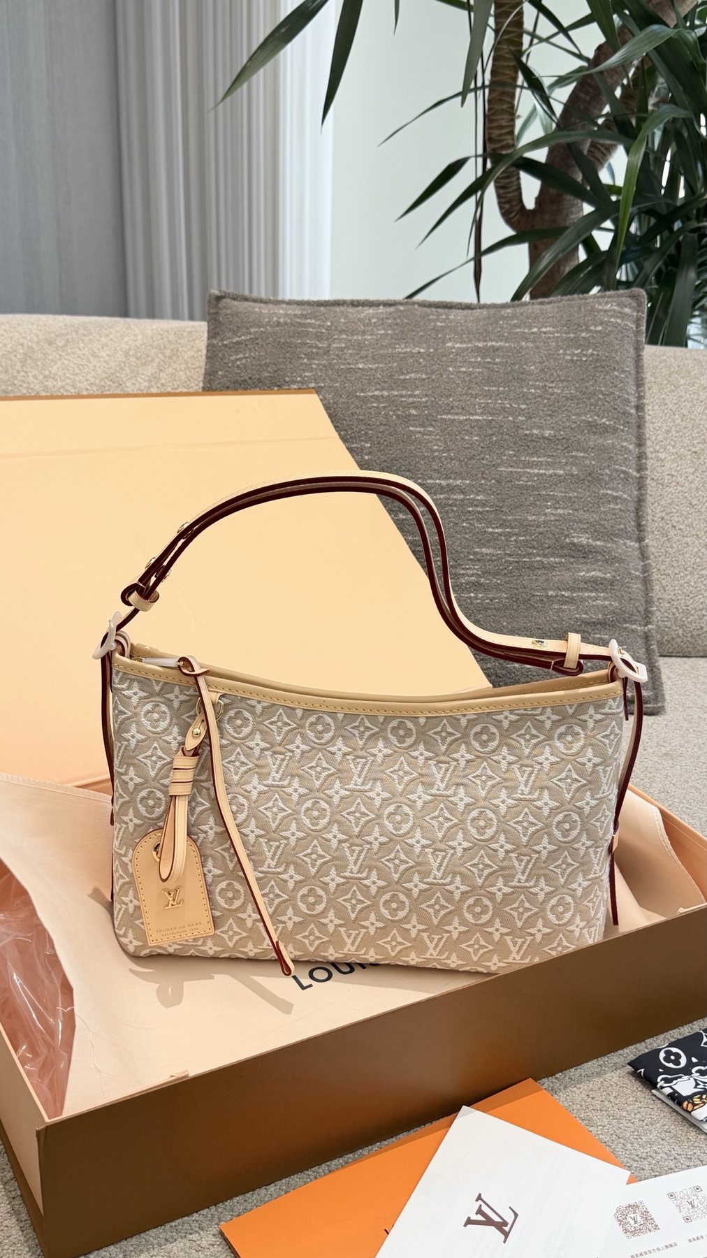 Louis Vuitton Carryall East West Raised Monogram Shoulder Bag — front