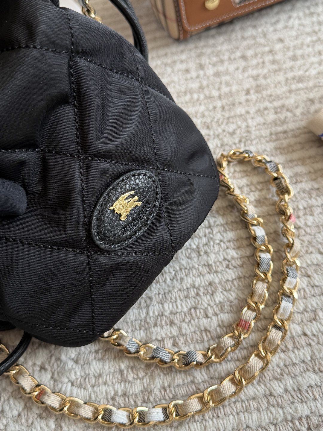 Black Quilted Chain-Strap Bucket Bag — detail