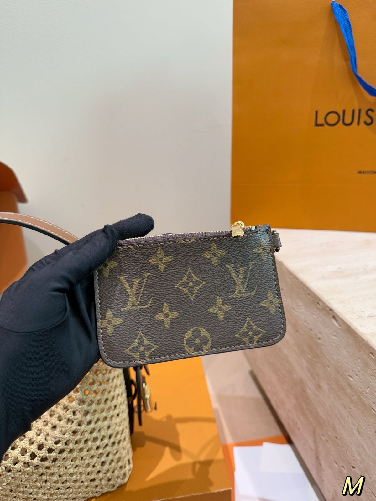 Louis Vuitton Woven Bucket Bag with Monogram Pouch — detail
