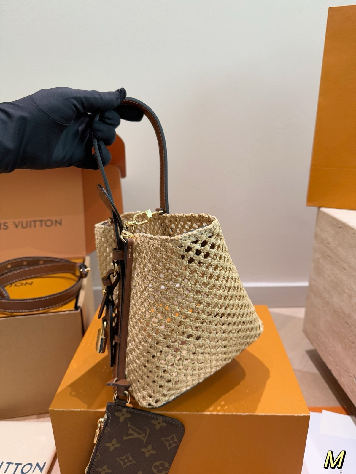 Louis Vuitton Woven Bucket Bag with Monogram Pouch — hero