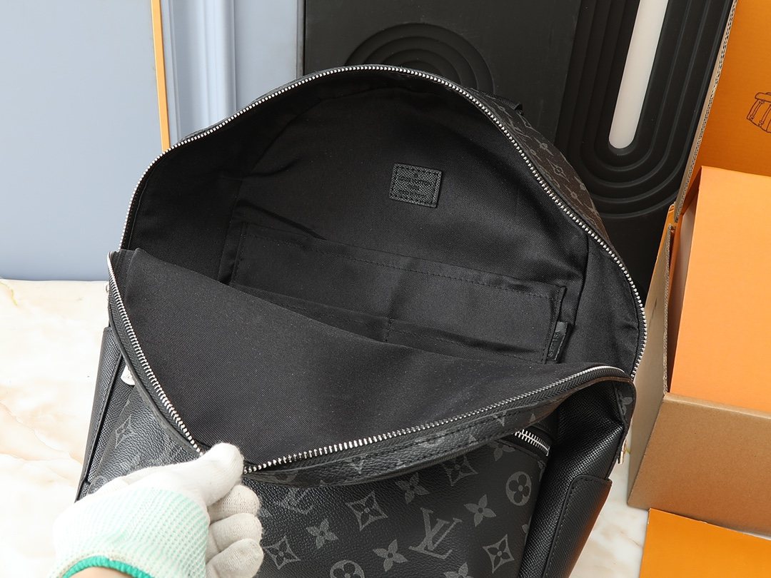 Louis Vuitton Discovery Monogram Backpack — front