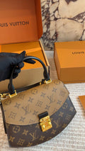 Louis Vuitton Tilsitt Two-Tone Monogram Top-Handle Bag — hero