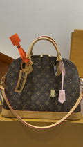 Louis Vuitton Monogram Bolide Dome Handbag — hero