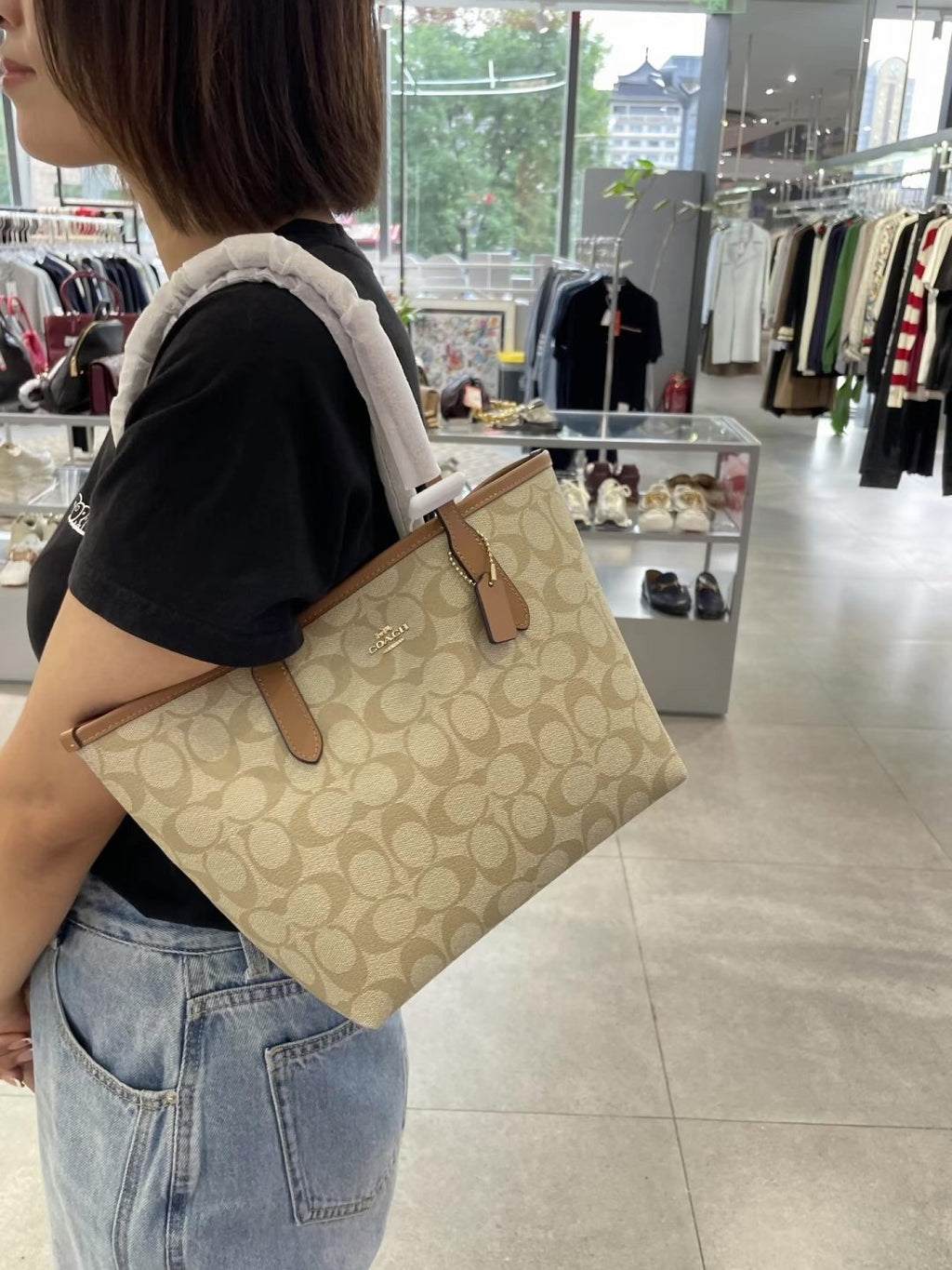 Coach City Tote in Signature Coated Canvas — model