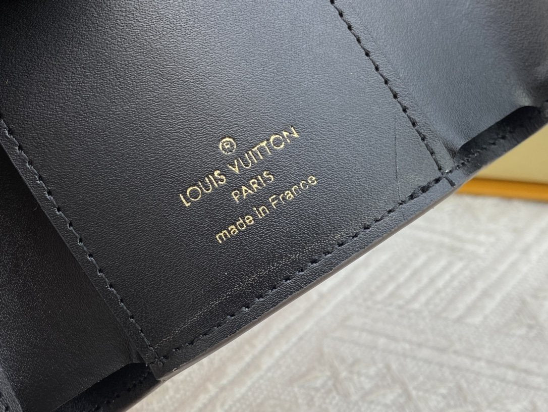 Louis Vuitton Monogram Trunk-Clasp Compact Wallet — detail