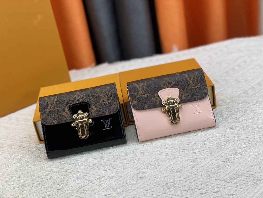 Louis Vuitton Monogram Trunk-Clasp Compact Wallet — comparison