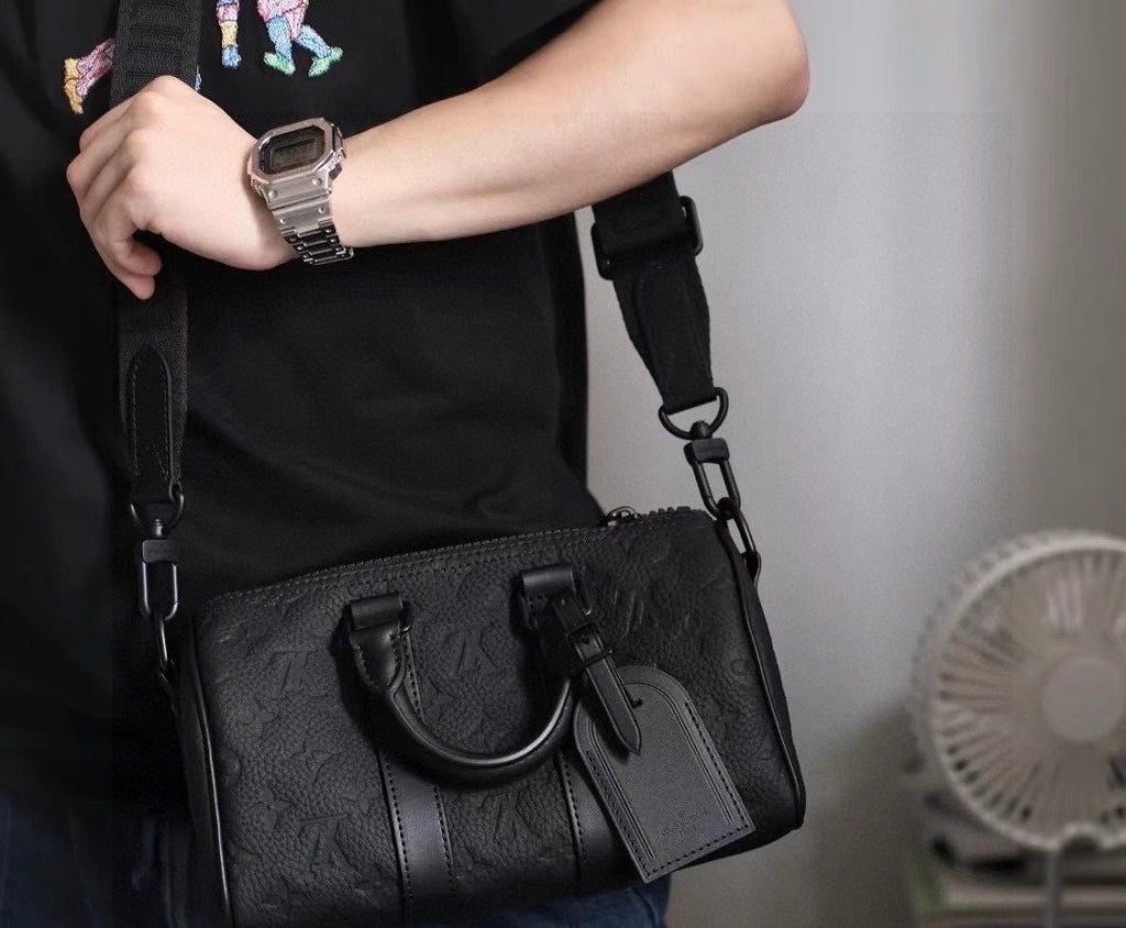 Louis Vuitton Keepall Embossed Monogram Duffel Bag — model