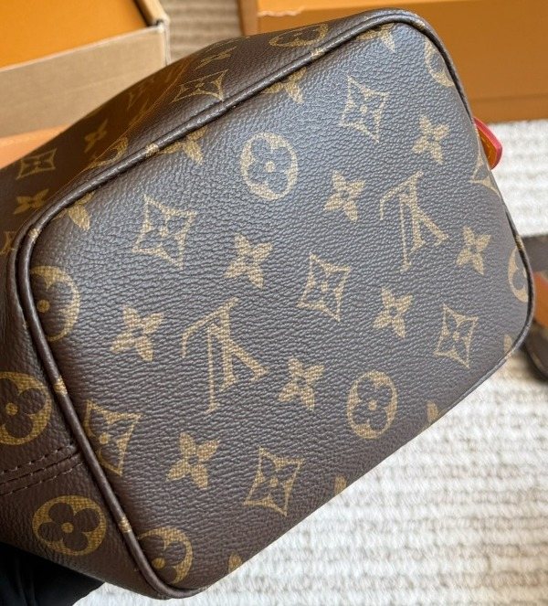 Louis Vuitton Monogram Buckle-Strap Bucket Bag — detail